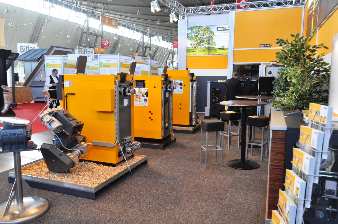 Solid-fuel pellet room heaters at a professional heating trade fair